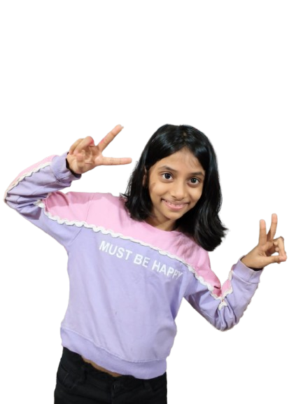 Ameera giving two peace signs, wearing a pink and lavender sweatshirt that says Must Be Happy